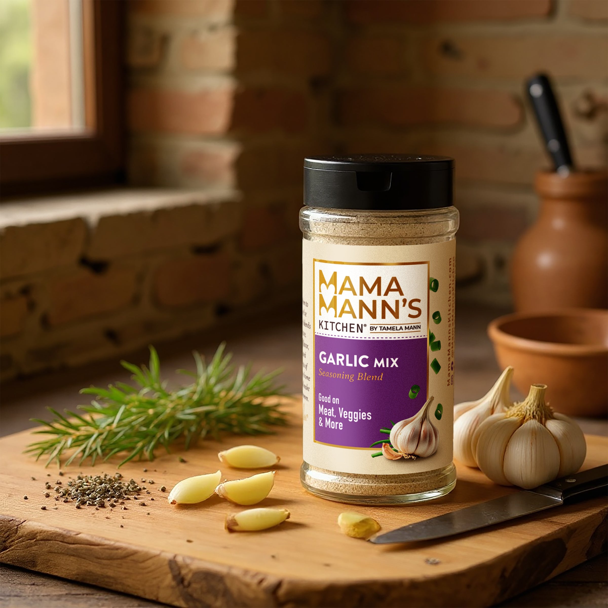 Mama Mann's Garlic Mix jar on a wooden cutting board with garlic and herbs in a kitchen setting