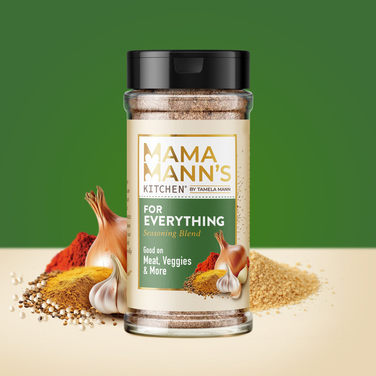 Spice jar labeled 'Mama Mann's Kitchen' with various spices around on a green background